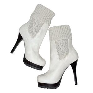 Cream stiletto ankle boots.